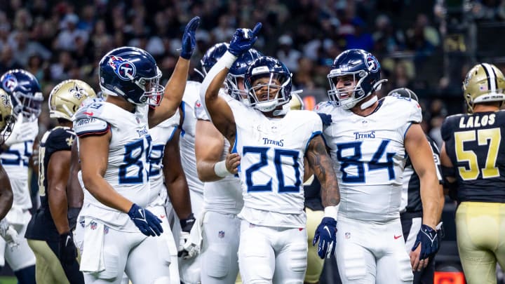 Aug 25, 2024; New Orleans, Louisiana, USA; Tennessee Titans running back Tony Pollard (20) gives thanks for a touchdown against the New Orleans Saints during the first half at Caesars Superdome. Mandatory Credit: Stephen Lew-USA TODAY Sports