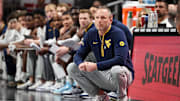 Mar 12, 2025; Kansas City, MO, USA; West Virginia Mountaineers coach Darian DeVries watches game play during the first half against the Colorado Buffaloes at T-Mobile Center. Mandatory Credit: William Purnell-Imagn Images