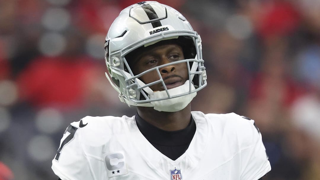 Dec 21, 2025; Houston, Texas, USA; Las Vegas Raiders quarterback Geno Smith (7) reacts after a play during the game against the Houston Texans at NRG Stadium. Mandatory Credit: Troy Taormina-Imagn Images