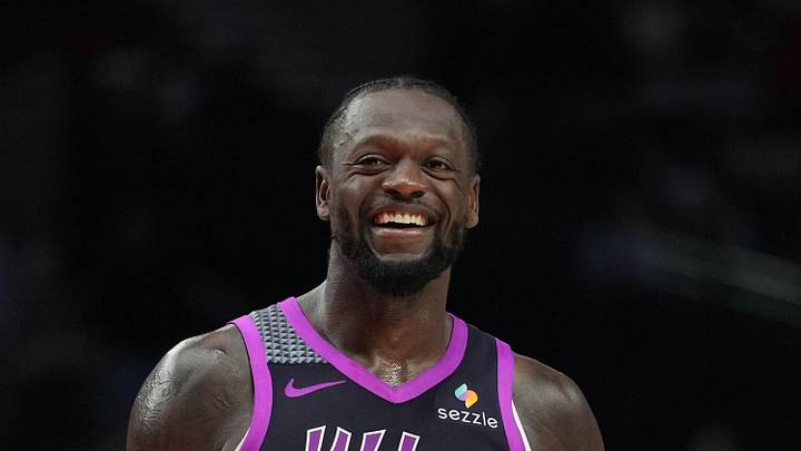 Feb 24, 2026; Portland, Oregon, USA; Minnesota Timberwolves forward Julius Randle (30) and Portland Trail Blazers guard Jrue Holiday (5) share a laugh during the second half at Moda Center. Mandatory Credit: Soobum Im-Imagn Images