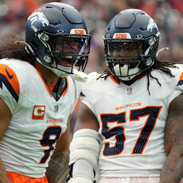 Nov 2, 2025; Houston, Texas, USA; Denver Broncos safety Talanoa Hufanga (9) and Denver Broncos linebacker Dre Greenlaw (57) celebrate after a play during the first half against the Houston Texans at NRG Stadium. 