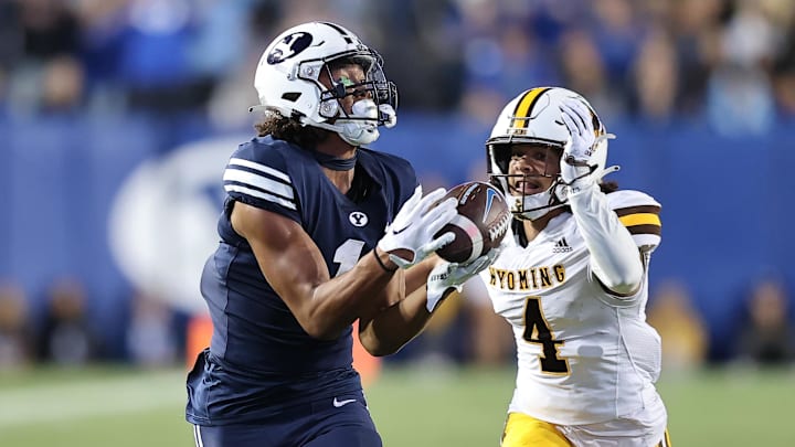 Sep 24, 2022; Provo, Utah, USA; Brigham Young Cougars wide receiver Keanu Hill (1) makes a catch for a touchdown in front of Wyoming Cowboys cornerback Cameron Stone (4) in the fourth quarter at LaVell Edwards Stadium.