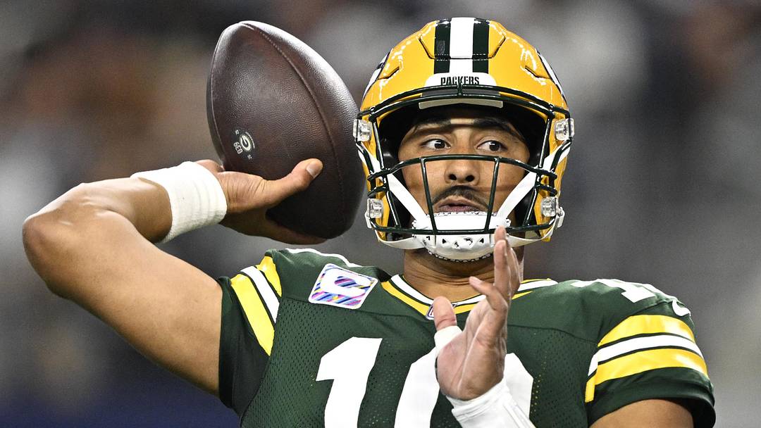 Green Bay Packers quarterback Jordan Love throws a touchdown pass at Dallas.