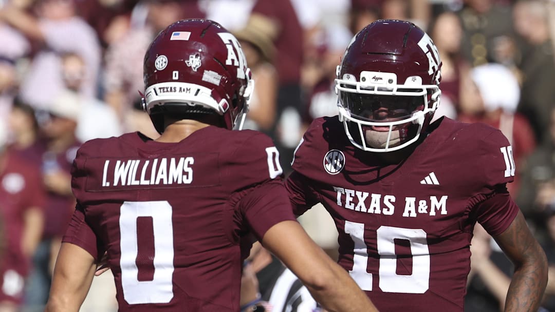 Nov 15, 2025; College Station, Texas, USA; Texas A&M Aggies quarterback Marcel Reed (10) celebrates with wide receiver Izaiah Williams (0) after an Aggies touchdown during the third quarter against the South Carolina Gamecocks at Kyle Field. Mandatory Credit: Troy Taormina-Imagn Images