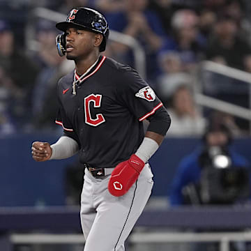 May 4, 2025; Toronto, Ontario, CAN; Cleveland Guardians center fielder Angel Martinez (1) is walked home by Toronto Blue Jays pitcher Brendon Little (not pictured) during the ninth inning at Rogers Centre. Mandatory Credit: John E. Sokolowski-Imagn Images
