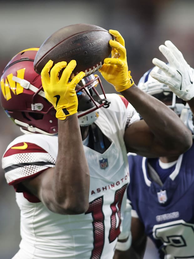 Washington Commanders wide receiver Olamide Zaccheaus (14) and Dallas Cowboys cornerback Jourdan Lewis (2)