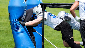 Detroit Lions defensive end Aidan Hutchinson (97) practices during OTA at Meijer Performance Center in Allen Park on Friday, May 30, 2025.
