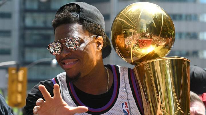 Jun 17, 2019; Toronto, Ontario, Canada;  Toronto Raptors guard Kyle Lowry shows off the Larry O'Brien trophy to fans during a parade through downtown Toronto to celebrate their NBA title. Mandatory Credit: Dan Hamilton-Imagn Images