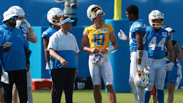 Los Angeles Chargers quarterback Justin Herbert talks to tight end Donald Parham Jr. during the first day of training camp.