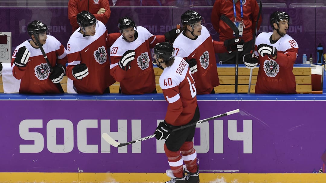 Feb 16, 2014; Sochi, RUSSIA; Austria forward Michael Grabner (40) is congratulated by teammates after scoring a goal against Norway in a men's preliminary round hockey game during the Sochi 2014 Olympic Winter Games at Bolshoy Ice Dome. Mandatory Credit: Scott Rovak-Imagn Images