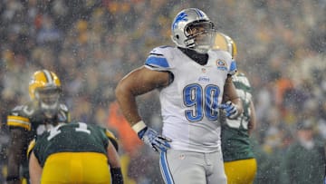 Dec 9, 2012; Green Bay, WI, USA;   Detroit Lions defensive tackle Ndamukong Suh (90) reacts after a Green Bay Packers first down at Lambeau Field.  Mandatory Credit: Benny Sieu-Imagn Images