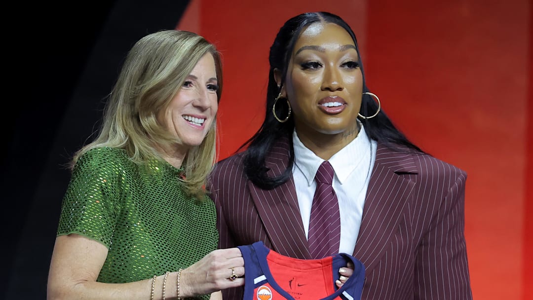 Apr 13, 2026; New York, NY, USA;  WNBA Commissioner Cathy Engelbert (left) poses for photos with Cotie McMahon who was selected eleventh overall by the Washington Mystics during the 2026 WNBA Draft at The Shed at Hudson Yards. Mandatory Credit: Brad Penner-Imagn Images