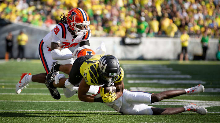 Oregon wide receiver Justius Lowe dives as he is tackled as the No. 1 Oregon Ducks host the No. 21 Illinois Fighting Illini Saturday, Oct. 26, 2024 at Autzen Stadium in Eugene, Ore. Oregon wide receiver Justius Lowe dives as he is tackled as the No. 1 Oregon Ducks host the No. 21 Illinois Fighting Illini Saturday, Oct. 26, 2024 at Autzen Stadium in Eugene, Ore.