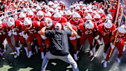 Oct 4, 2025; Raleigh, North Carolina, USA;  NC State Wolfpack head coach Dave Doeren with his team prepare to run out prior to the first half of the game against Campbell Fighting Camels at Carter-Finley Stadium. Mandatory Credit: Jaylynn Nash-Imagn Images