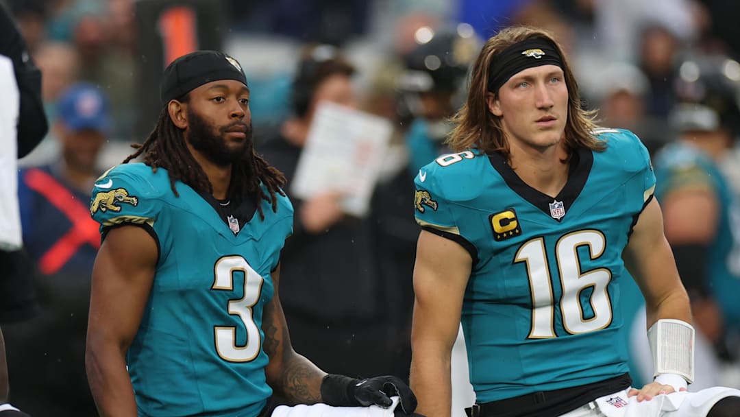 Dec 7, 2025; Jacksonville, Florida, USA; Jacksonville Jaguars wide receiver Jakobi Meyers (3) and quarterback Trevor Lawrence (16) take a knee during an injury time out in the first half against the Indianapolis Colts at EverBank Stadium. Mandatory Credit: Matt Pendleton-Imagn Images
