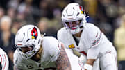 Sep 7, 2025; New Orleans, Louisiana, USA;  Arizona Cardinals guard Hjalte Froholdt (72) hikes the ball to quarterback Kyler Murray (1) against the New Orleans Saints at Caesars Superdome. Mandatory Credit: Stephen Lew-Imagn Images