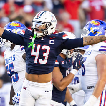 Nov 8, 2025; Tucson, Arizona, USA; Arizona Wildcats defensive back Dalton Johnson (43) celebrates a missed field goal by the Kansas Jayhawks in the second half at Arizona Stadium. Mandatory Credit: Mark J. Rebilas-Imagn Images