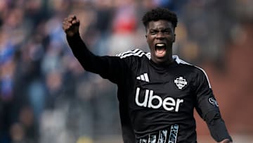 Assane Diao of Como 1907 celebrates after an own goal scored...