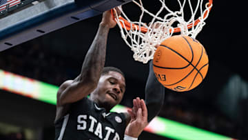 Mississippi State Bulldogs guard Shawn Jones Jr. (5) dunks over LSU Tigers guard Jordan Wright (6) during their second round game of the SEC Men's Basketball Tournament at Bridgestone Arena in Nashville, Tenn., Thursday, March 14, 2024.