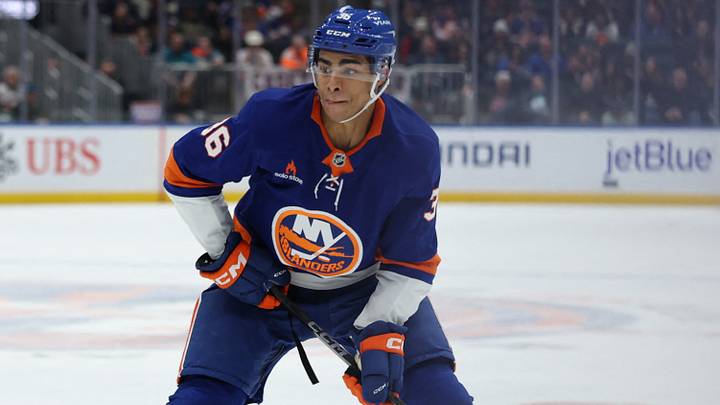 Jan 18, 2025; Elmont, New York, USA; New York Islanders defenseman Isaiah George (36) looks to move the puck against the San Jose Sharks during the second period at UBS Arena. Jan 18, 2025; Elmont, New York, USA; New York Islanders defenseman Isaiah George (36) looks to move the puck against the San Jose Sharks during the second period at UBS Arena.