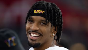 Sep 29, 2024; Glendale, Arizona, USA; Washington Commanders quarterback Jayden Daniels (5) against the Arizona Cardinals at State Farm Stadium. Mandatory Credit: Mark J. Rebilas-Imagn Images