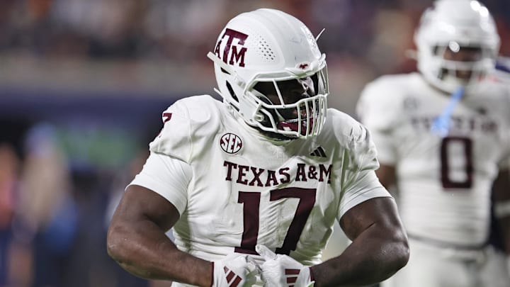 Nov 23, 2024; Auburn, Alabama, USA;  Texas A&M Aggies defensive lineman Albert Regis (17) reacts after making a tackle against the Auburn Tigers in the third quarter at Jordan-Hare Stadium. 