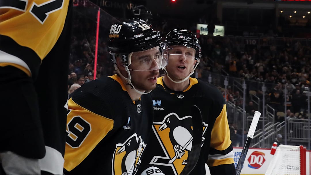 Mar 5, 2024; Pittsburgh, Pennsylvania, USA; Pittsburgh Penguins right wing Reilly Smith (19) celebrates his goal with defenseman Chad Ruhwedel (right) against the Columbus Blue Jackets during the third period at PPG Paints Arena. The Penguins won 5-3. Mandatory Credit: Charles LeClaire-Imagn Images