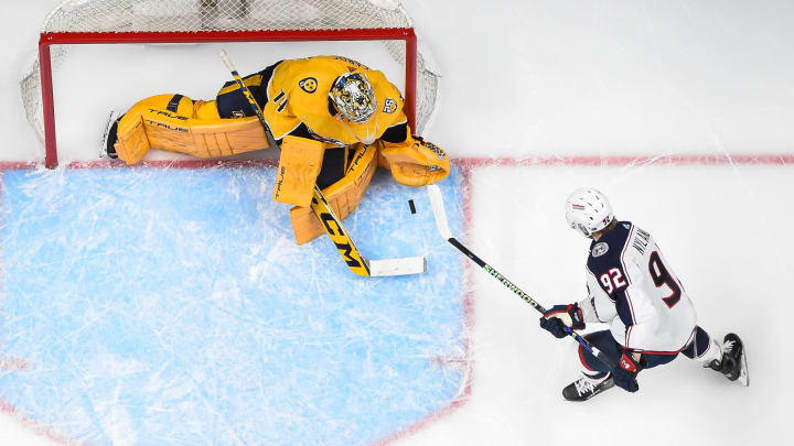 Apr 13, 2024; Nashville, Tennessee, USA; Nashville Predators goaltender Juuse Saros (74) blocks the shot of Columbus Blue Jackets left wing Alexander Nylander (92) during the first period at Bridgestone Arena. Mandatory Credit: Steve Roberts-USA TODAY Sports