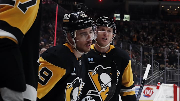 Mar 5, 2024; Pittsburgh, Pennsylvania, USA; Pittsburgh Penguins right wing Reilly Smith (19) celebrates his goal with defenseman Chad Ruhwedel (right) against the Columbus Blue Jackets during the third period at PPG Paints Arena. The Penguins won 5-3. Mandatory Credit: Charles LeClaire-Imagn Images