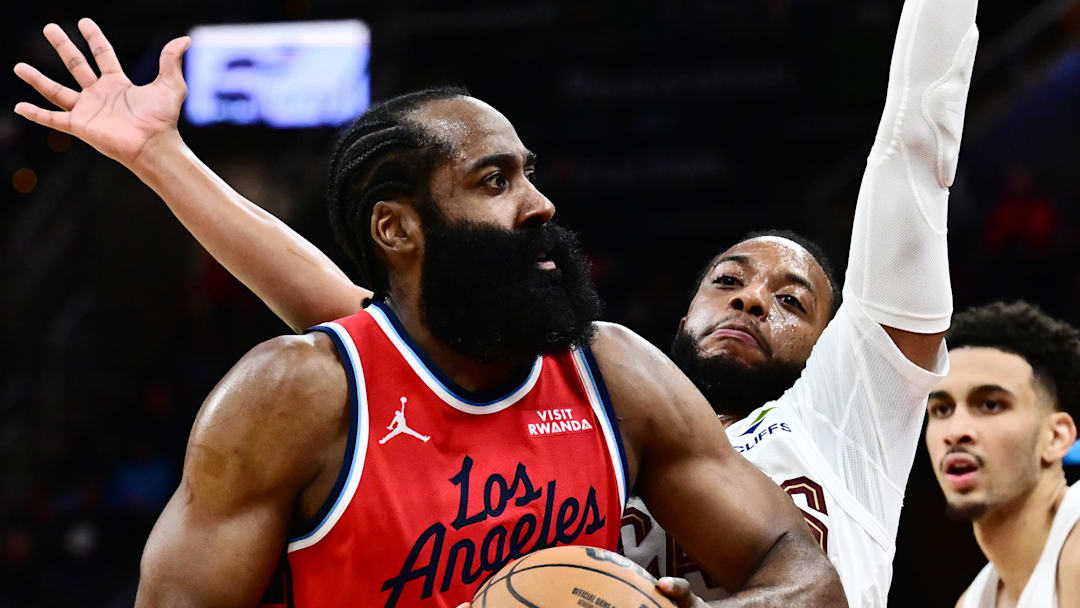 Nov 23, 2025; Cleveland, Ohio, USA; Los Angeles Clippers guard James Harden (1) drives to the basket against Cleveland Cavaliers guard Darius Garland (10) during the second half at Rocket Arena. Mandatory Credit: Ken Blaze-Imagn Images
