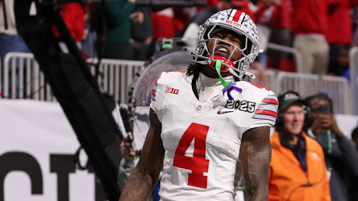 Jan 20, 2025; Atlanta, GA, USA; Ohio State Buckeyes wide receiver Jeremiah Smith (4) reacts after scoring against the Notre Dame Fighting Irish a touchdown during the first half the CFP National Championship college football game at Mercedes-Benz Stadium. Mandatory Credit: Brett Davis-Imagn Images