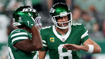 Sep 19, 2024; East Rutherford, New Jersey, USA; New York Jets quarterback Aaron Rodgers (8) talks to running back Breece Hall (20) during warmups before a game against the New England Patriots at MetLife Stadium. Mandatory Credit: Brad Penner-Imagn Images