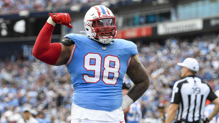 Oct 29, 2023; Nashville, Tennessee, USA; Tennessee Titans defensive tackle Jeffery Simmons (98) flexes after a tackle against the Atlanta Falcons during the first half at Nissan Stadium. Mandatory Credit: Steve Roberts-USA TODAY Sports