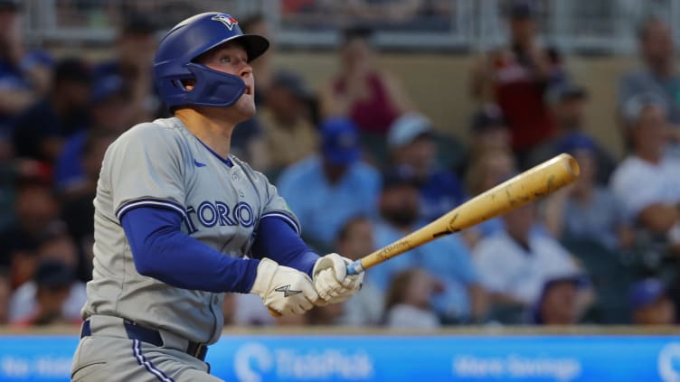 Aug 31, 2024; Minneapolis, Minnesota, USA; Toronto Blue Jays second baseman Will Wagner (7) follows through on a solo home run against the Minnesota Twins in the sixth inning at Target Field. Mandatory Credit: Bruce Kluckhohn-USA TODAY Sports