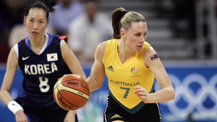 Aug 13, 2008; Beijing, CHINA; Australia forward Penny Taylor (7) brings the ball up the court past Korea center Jongae Lee (8) during the second half of a preliminary round game at the Olympic Basketball Gymnasium during the 2008 Beijing Olympic Games. Mandatory Credit: Jerry Lai-Imagn Images