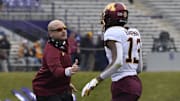 Nov 23, 2019; Evanston, IL, USA; Minnesota Golden Gophers head coach PJ Fleck congratulates Minnesota Golden Gophers wide receiver Rashod Bateman (13) after his touchdown against the Northwestern Wildcats during the first half at Ryan Field. Mandatory Credit: David Banks-Imagn Images