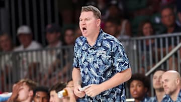 Nov 29, 2024; Paradise Island, Bahamas, BHS;  Arizona Wildcats head coach Tommy Lloyd reacts against the West Virginia Mountaineers during the first half at Imperial Arena at the Atlantis resort.