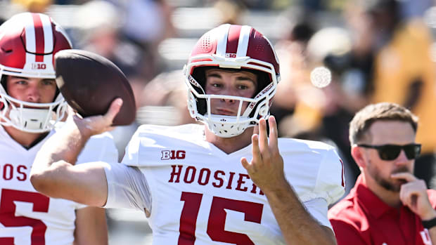 Indiana Hoosiers quarterback Fernando Mendoza (15) warms up at Kinnick Stadium before the game against the Iowa Hawkeyes.