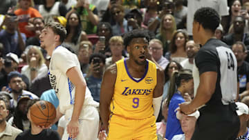 Los Angeles Lakers guard Bronny James reacts to a foul call against Dallas Mavericks forward Cooper Flagg.