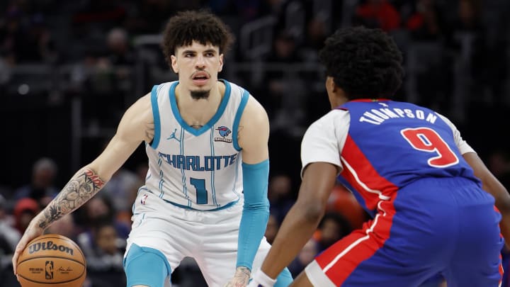 Jan 24, 2024; Detroit, Michigan, USA;  Charlotte Hornets guard LaMelo Ball (1) dribbles defended by Detroit Pistons forward Ausar Thompson (9) in the second half at Little Caesars Arena. 