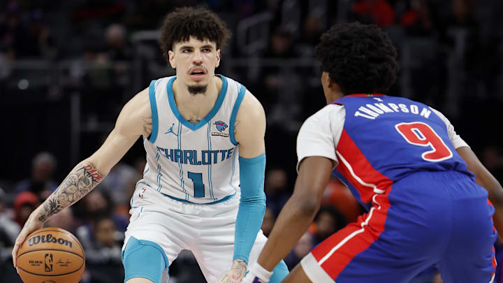 Jan 24, 2024; Detroit, Michigan, USA;  Charlotte Hornets guard LaMelo Ball (1) dribbles defended by Detroit Pistons forward Ausar Thompson (9): Rick Osentoski-Imagn Images