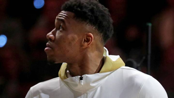  Oct. 19, 2021; Milwaukee, WI, USA; Milwaukee Bucks forward Giannis Antetokounmpo (34) watches as the the Milwaukee Bucks' 2021 championship banner is unveiled with his Championship ring during Milwaukee Bucks ring ceremony; Mand atory credit: Mike De Sisti-USA TODAY NETWORK via Imagn Images 

