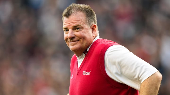 Miami (Oh) Redhawks head coach Chuck Martin runs onto the field before the NCAA football game between the Cincinnati Bearcats and the Miami RedHawks at Nippert Stadium in Cincinnati on Saturday, Sept. 16, 2023.