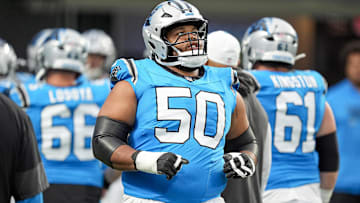 Aug 2, 2025; Charlottle, NC, USA; Carolina Panthers guard Robert Hunt (50) takes the field during Fanfest at Bank of America Stadium. Mandatory Credit: Jim Dedmon-Imagn Images