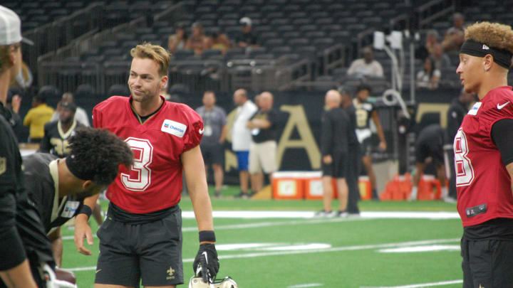 Jake Haener and Spencer Rattler at Saints training camp practice in the Superdome.