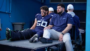 Tennessee Titans linebacker Jack Gibbens (50) is carted off the field during the third quarter against the Minnesota Vikings at Nissan Stadium in Nashville, Tenn., Sunday, Nov. 17, 2024.