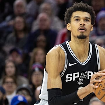 Dec 23, 2024; Philadelphia, Pennsylvania, USA; San Antonio Spurs center Victor Wembanyama (1) shoots the ball against the Philadelphia 76ers during the fourth quarter at Wells Fargo Center.