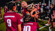 Arkansas players celebrate a 3-1 win against Alabama on Thursday night at Razorback Field in Fayetteville, Ark.