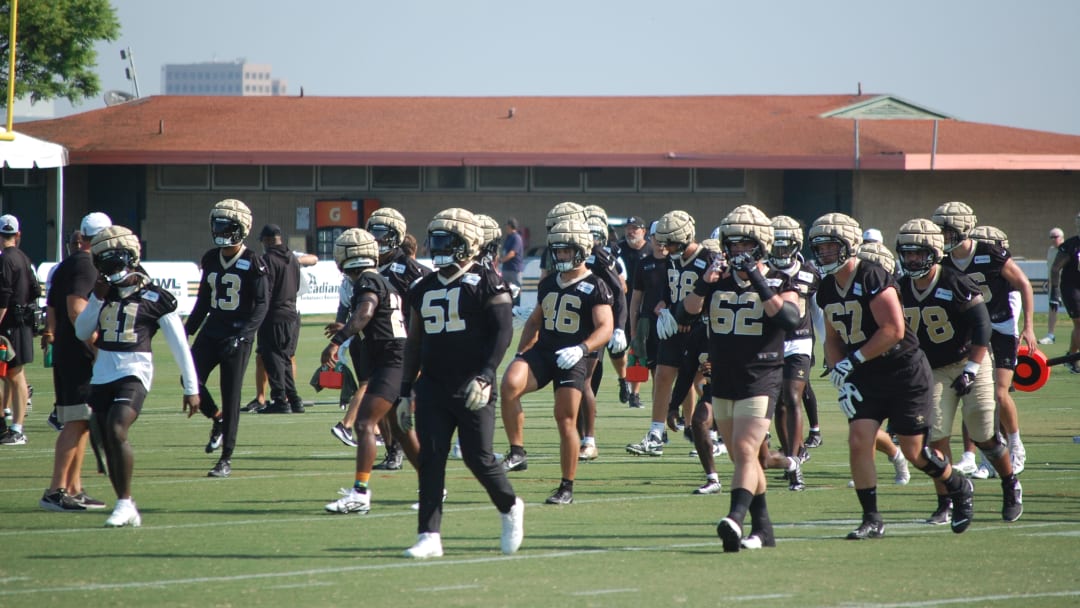 Saints stretching before Day 2 of training camp gets underway.