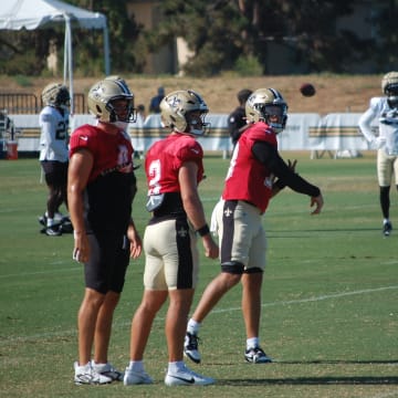 Derek Carr, Jake Haener and Spencer Rattler at Thursday's Saints training camp practice.